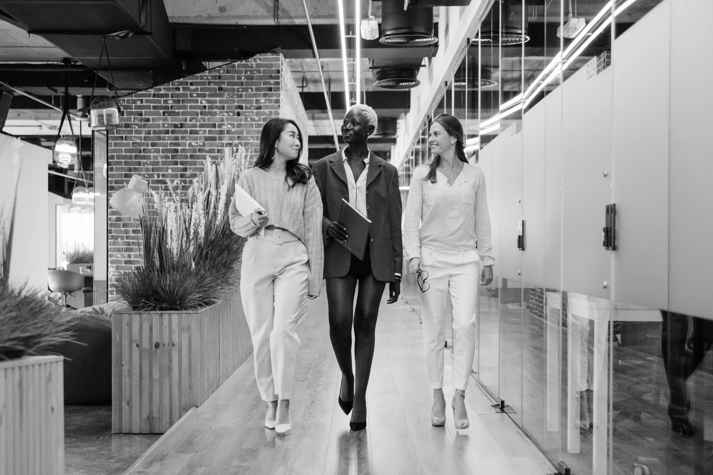 Illustrative photograph of three professionals collaborating