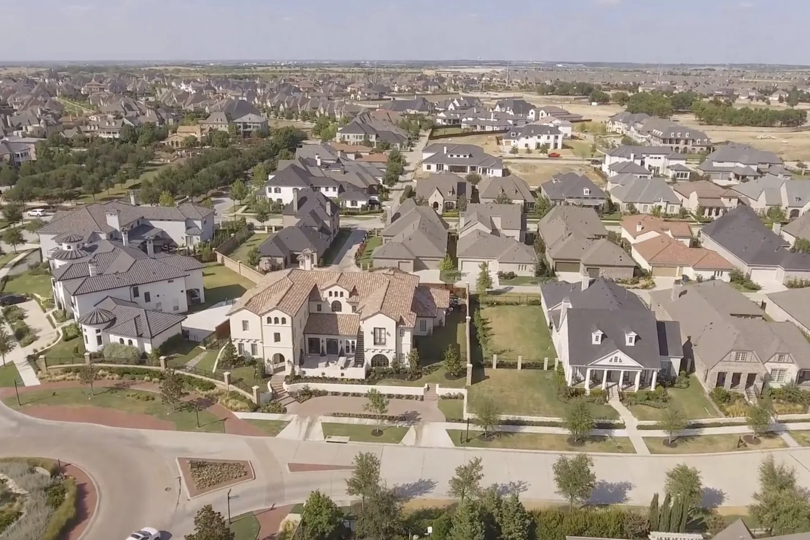 Official developer aerial of Newman Village homes and streets