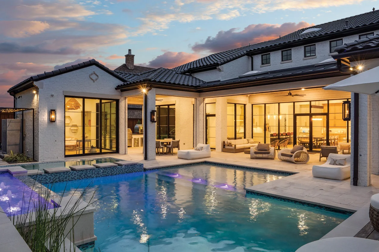 Actual twilight pool terrace at 6812 Mulhouse Court, a Normandy Estates residence