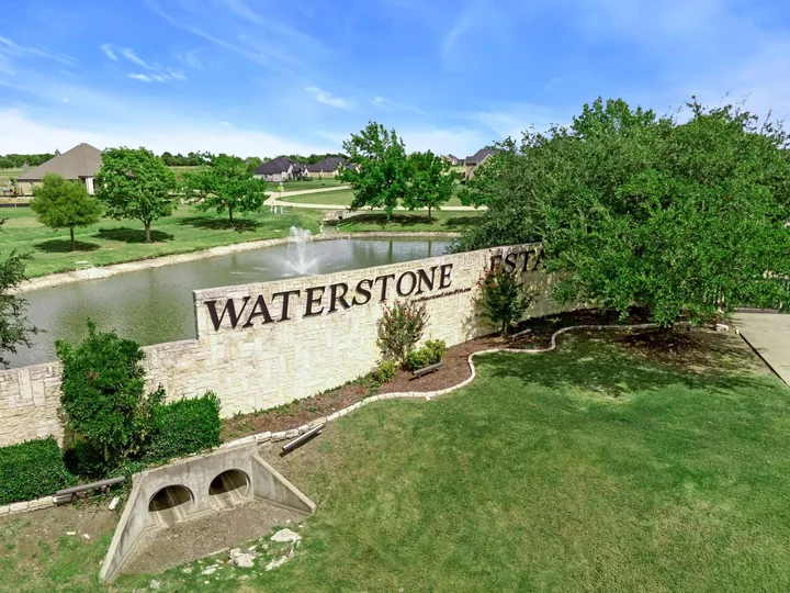 Drees Custom Homes aerial photograph of the named Waterstone Estates entry sign and pond