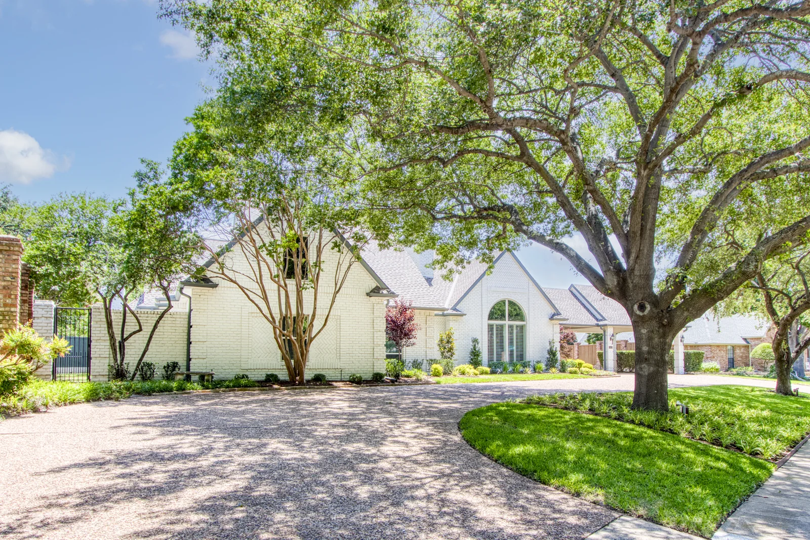 2400px real exterior photograph of 5216 Windjammer Road, a specific Willow Bend Lakes home, shown by the listing agent