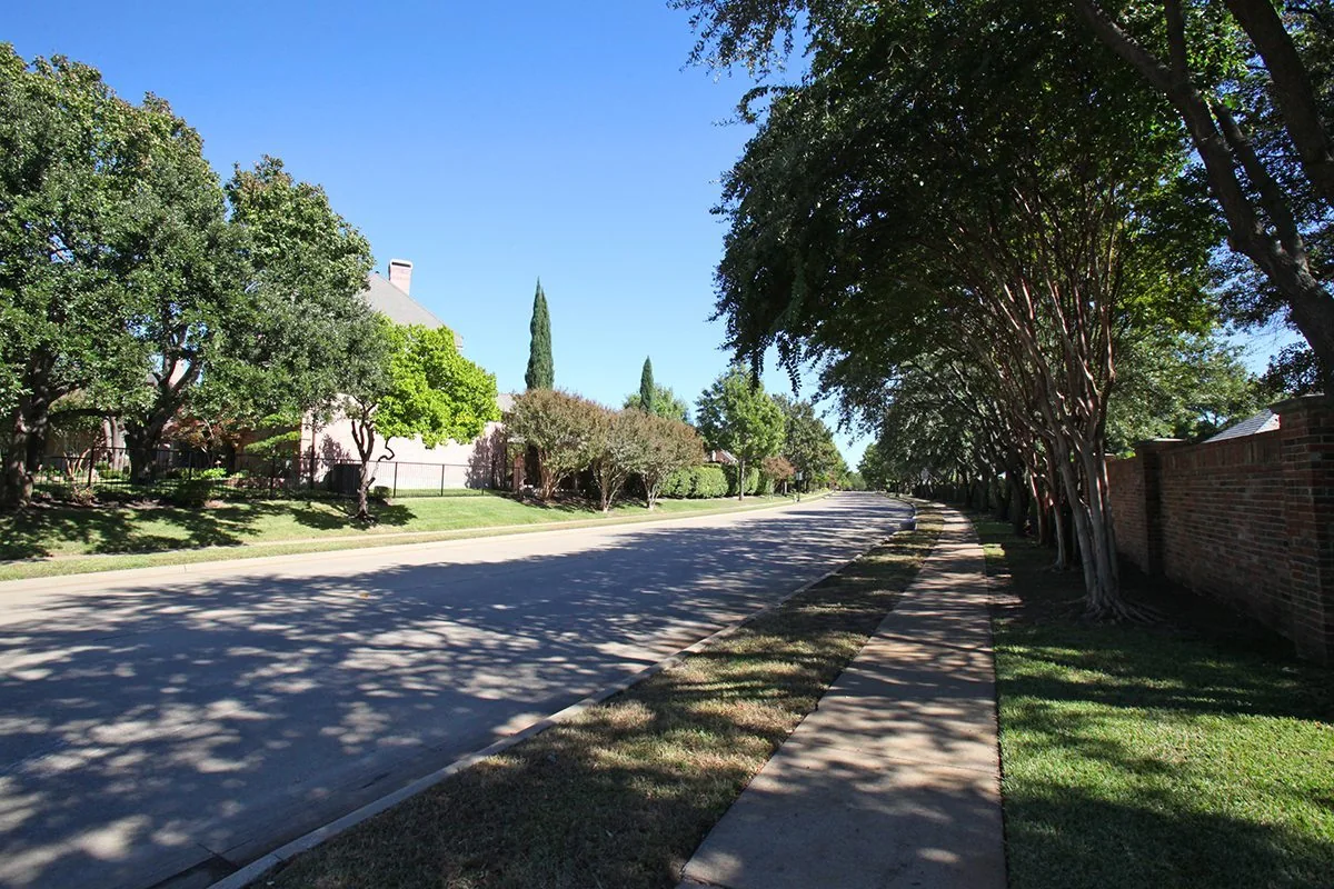 Tree-lined Willow Bend West neighborhood street