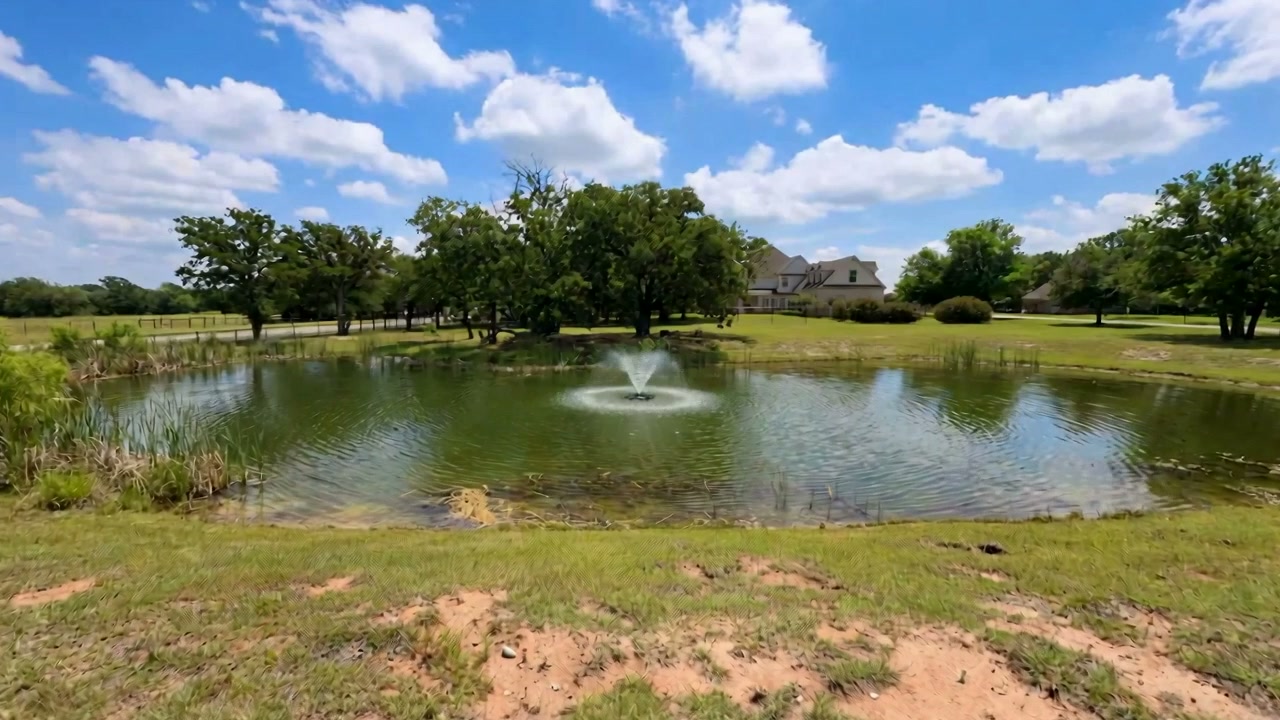 Stocked pond and grounds at 259 King Ranch Court